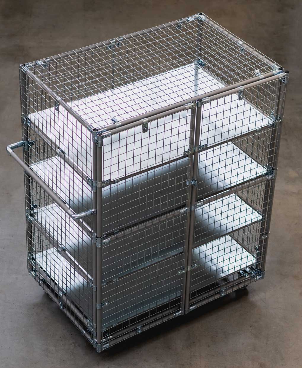 Mobile shelving made of pipe racking system with steel mesh covering and swinging doors