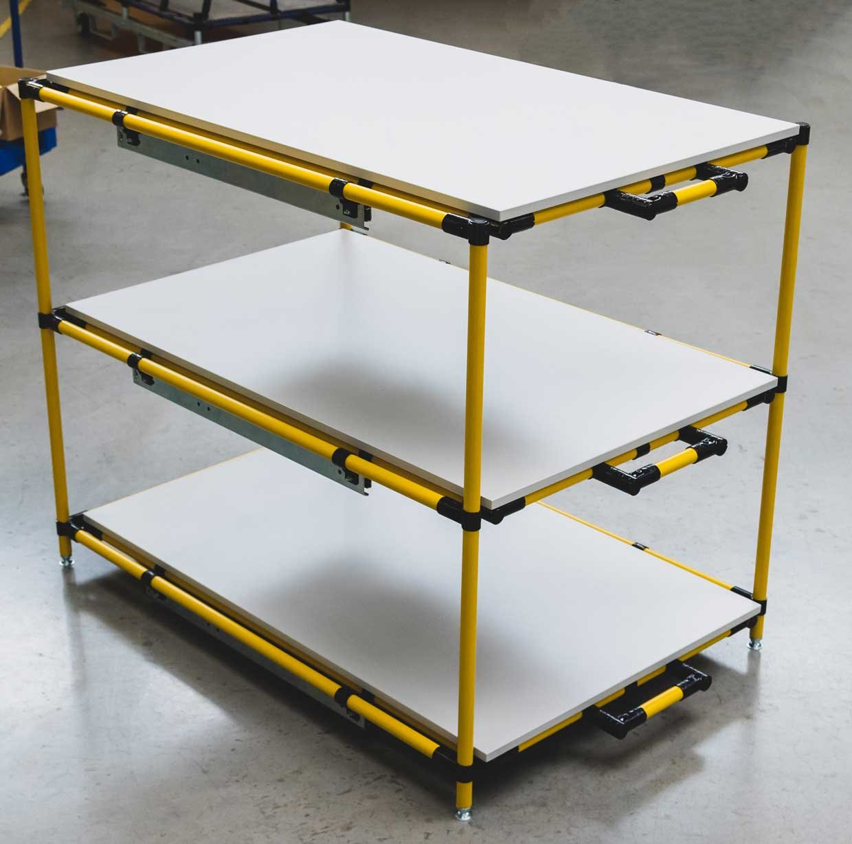 Shelf made of yellow steel pipes with three extendable levels 