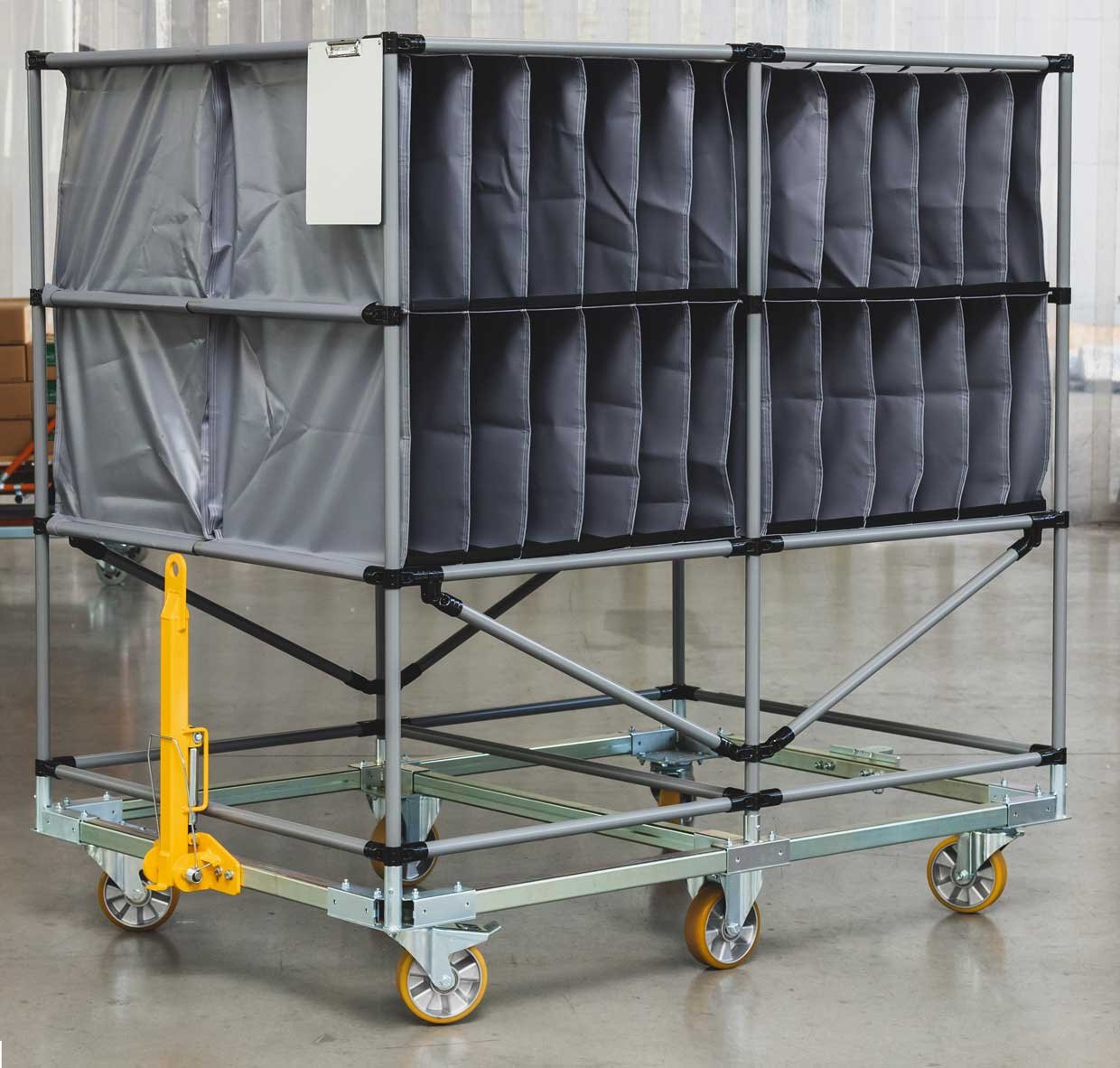 Transport trolley with fabric racks on a chassis frame made of steel square profiles with draw bar