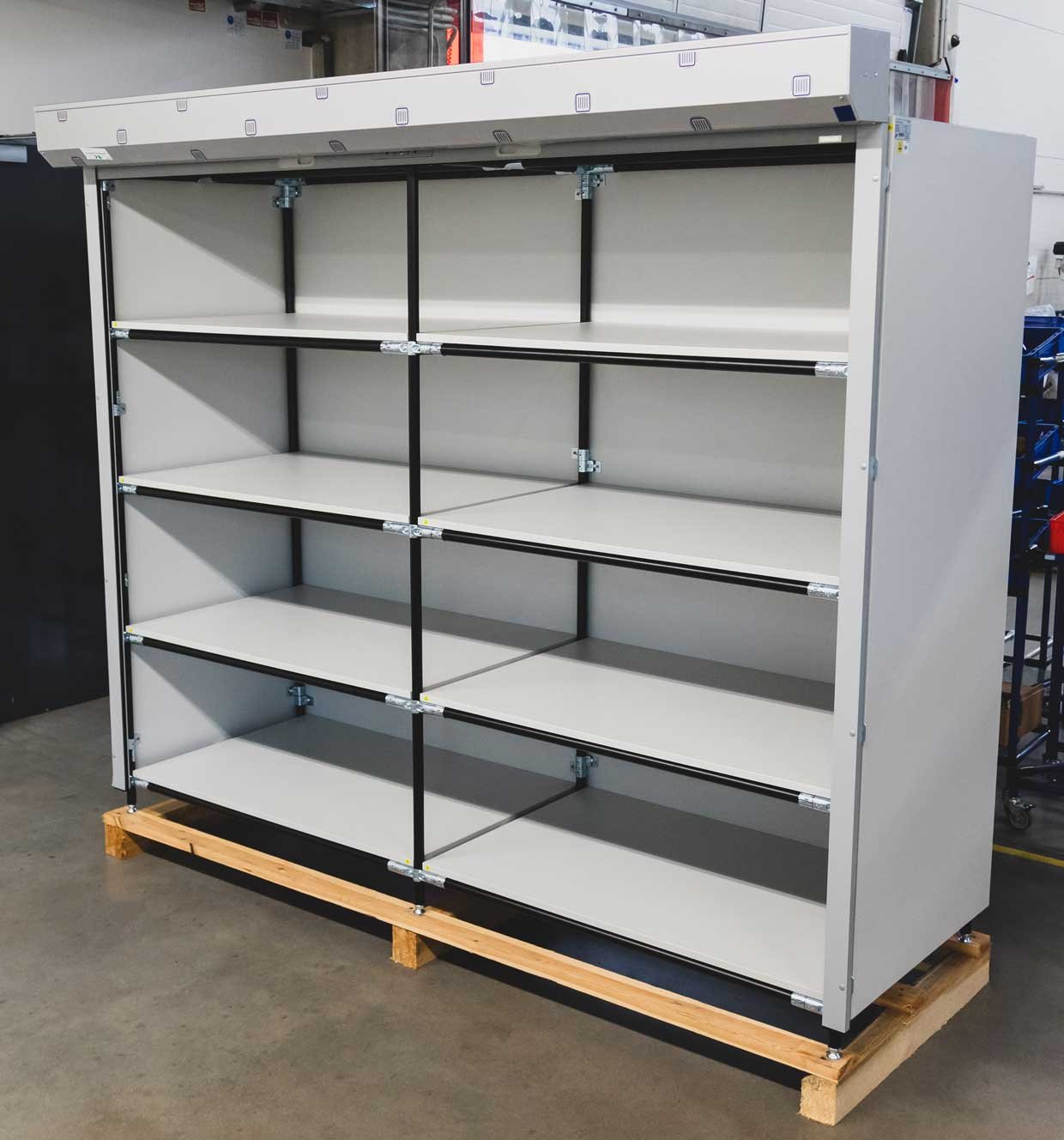 ESD shelving with tubular steel frame and wooden cladding