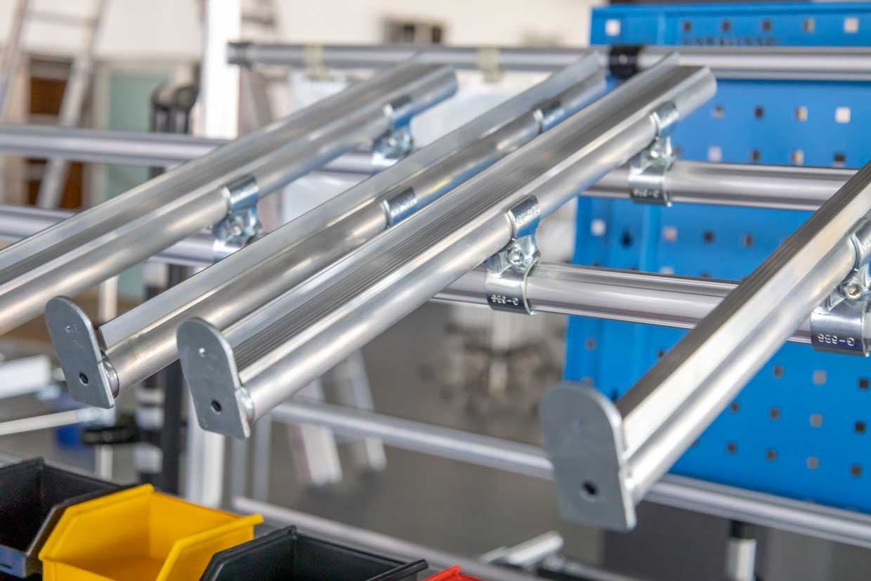 Sliding pipes for material supply on assembly lines