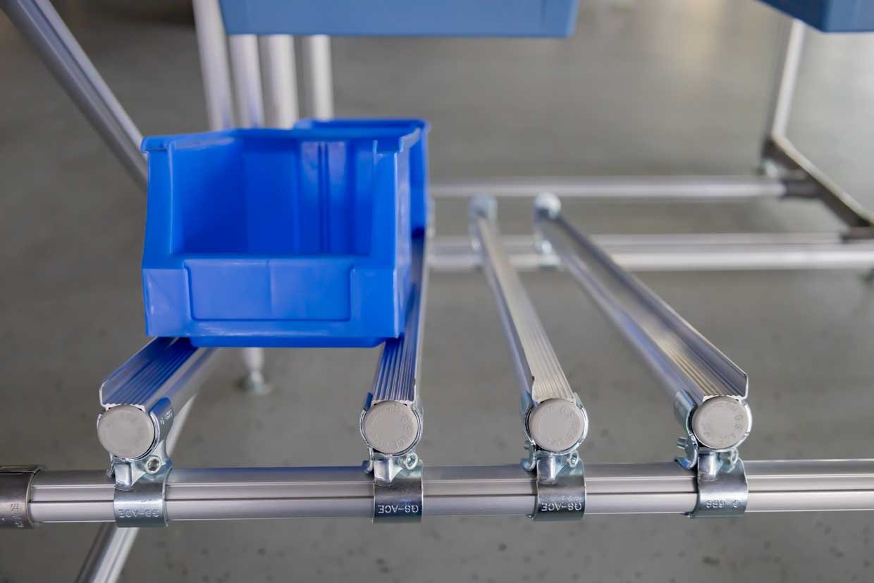 Integrated shelf track for empty containers