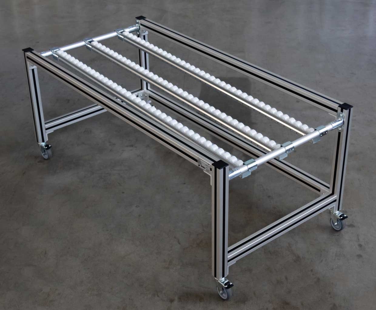 Movable shelf with rolling rails, made of aluminum square profiles and round pipes.