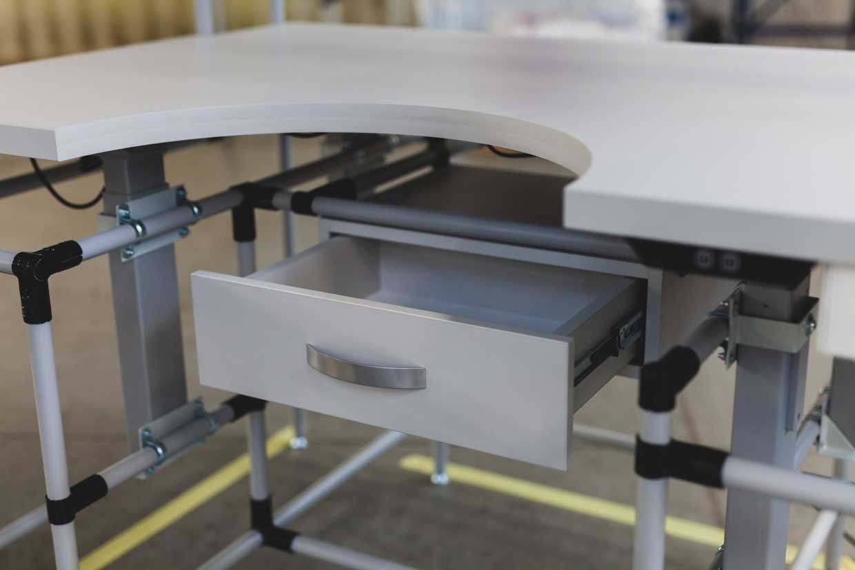 Industrial workstation with recessed worktop, drawer and frame made of pipe racking system