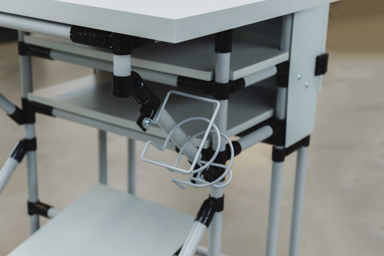 Beverage holder as an accessory for workstations in production